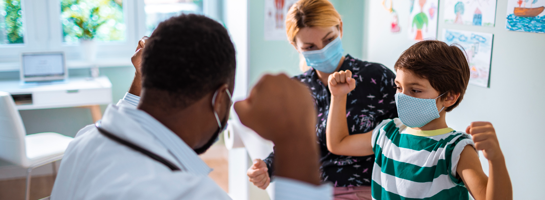 Child with parent and healthcare provider