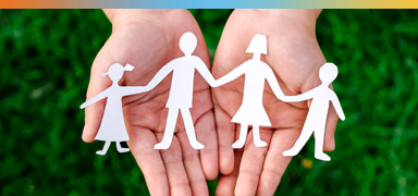 Paper Family cutout in hands