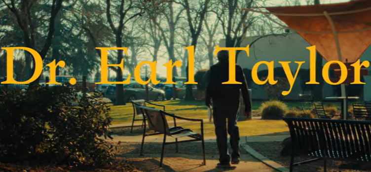 A man walking towards a bench with the name "Dr. Earl Taylor" over top.